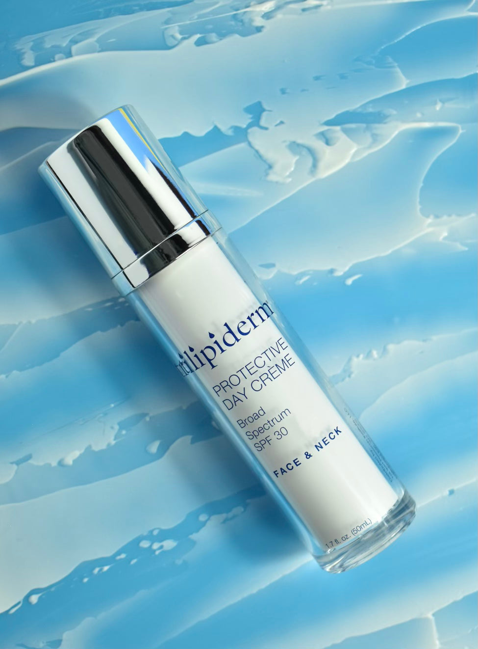 trilipiderm day creme laying down with silver top against a blue gradient background