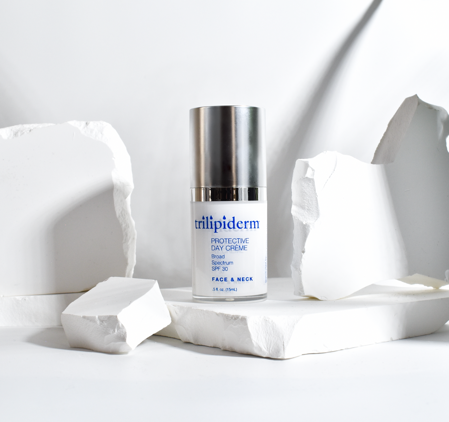 trilipiderm day creme displayed on white rock