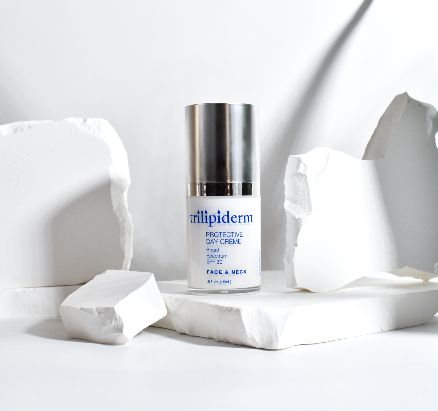 trilipiderm day creme displayed on white rock