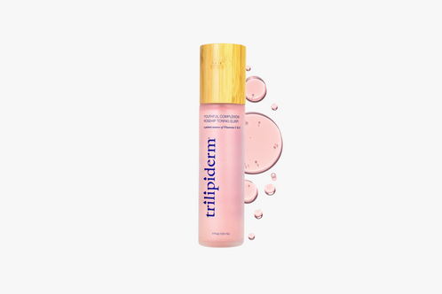 Trilipiderm bottle with pink label and gold cap on a white background and swatch