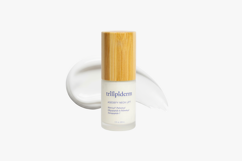 Skincare bottle with bamboo cap on a white background