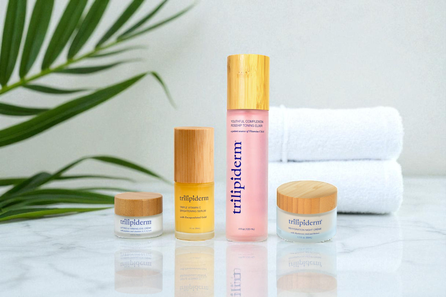 Trilipiderm skincare products on a marble surface with green leaves in the background