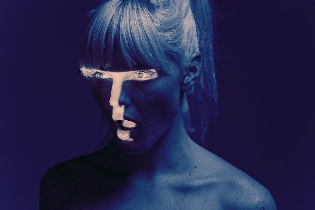 mysterious-blue-light-portrait-woman-expression-conceptual-art