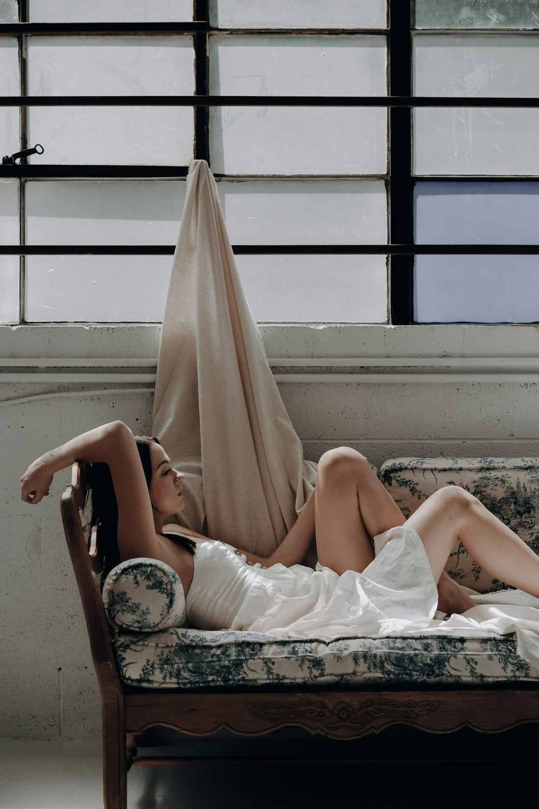 woman relaxing in a calm wellness setting focused on self care and skin health