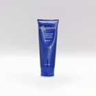 A blue tube of Trilipiderm Hydrating Exfoliant Cleanser for BODY placed against a white background.