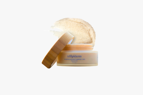 Cosmetic jar with a wooden applicator on a white background