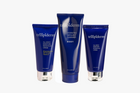 Three blue tubes of trillipiderm skincare products on a white background