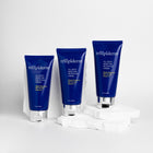 Three blue tubes of trilipiderm cream on a white background