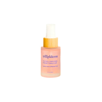 Trilipiderm Rosehip Toning Elixir 1 oz hydrating facial mist in frosted pink glass bottle with bamboo collar and fine spray nozzle. Barrier-supporting rosehip toner with antioxidant complex and humectants to promote smoother texture, refreshed skin, and luminous glass-skin finish. Clean luxury skincare treatment mist.