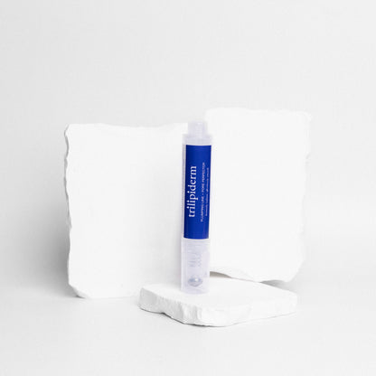 Trilipiderm Plumping Line and Pore Perfector serum pen with key ingredients hyaluronic acid green tea extract acai berry extract red algae extract and squalene — lightweight hydrating serum that blurs pores and fine lines while drenching skin in weightless hydration for a smoother plumper more radiant complexion