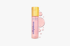 Trilipiderm bottle with pink label and gold cap on a white background and swatch