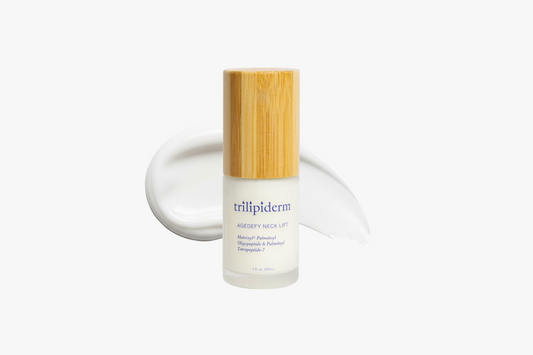 Skincare bottle with bamboo cap on a white background