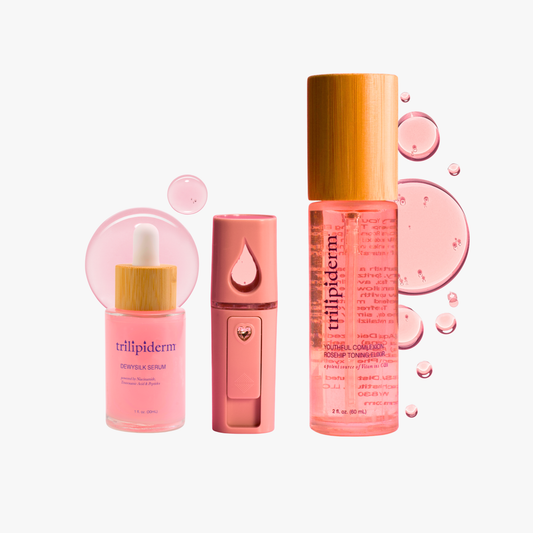 Trilipiderm DewySilk Serum, Rosehip Toner, and skincare mist bottle in soft pink tones with product droplets.