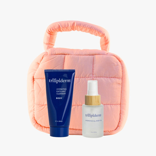 Trilipiderm Fragrance-Free Essence Duo with Hydrating All-Body Oil and Exfoliating Body Cleanser in peach puffer bag, gentle skincare set for sensitive skin.