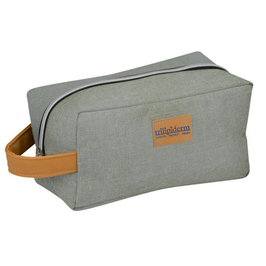 Trilipiderm Heather Gray Dopp Kit with tan leather handle and zipper closure — luxury travel toiletry bag for skincare essentials.