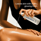 Model applying Trilipiderm Hydrating All-Body Oil to her leg, showing the lightweight oil texture and silky, luminous finish on moisturized skin.