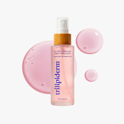 Trilipiderm Youthful Complexion Rosehip Toning Elixir, 2 oz (60 mL), featuring a frosted pink bottle with a natural bamboo cap and navy blue branding. Displayed with glossy pink serum droplets and a translucent rose-colored texture swatch on a clean white background.