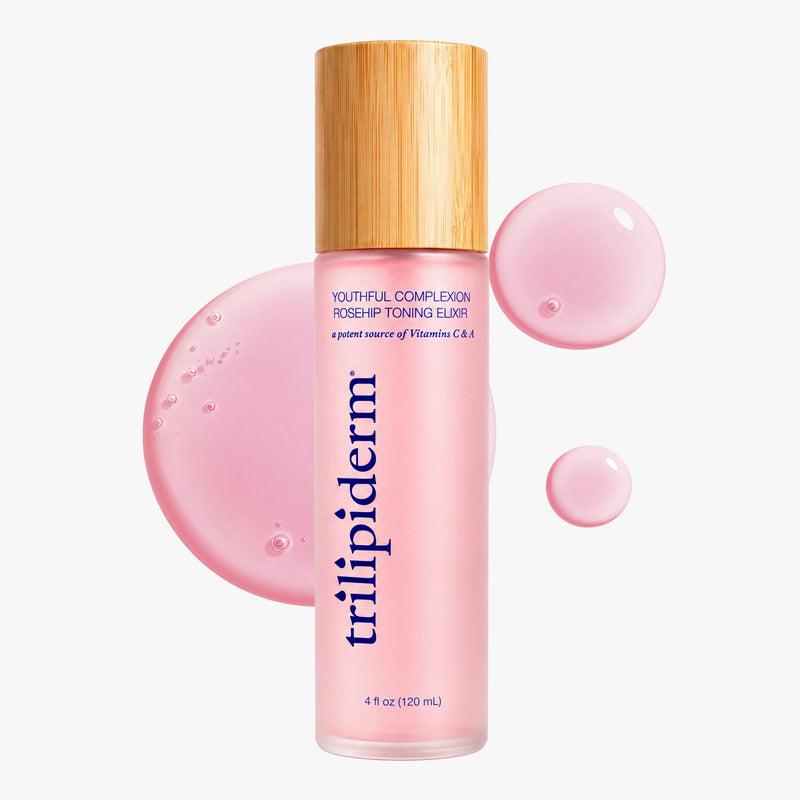 Trilipiderm Youthful Complexion Rosehip Toning Elixir, 4 oz (120 mL), in a frosted pink bottle with a natural bamboo cap and navy blue lettering. Surrounded by glossy pink serum droplets and a translucent rose-colored texture swatch against a clean white background.